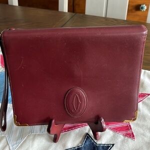 Cartier large leather envelope wristlet/clutch in excellent used conditions